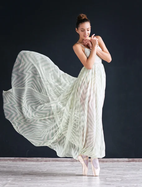 Portrait of the modern ballerina  in white dress on dark background — Stock Photo, Image