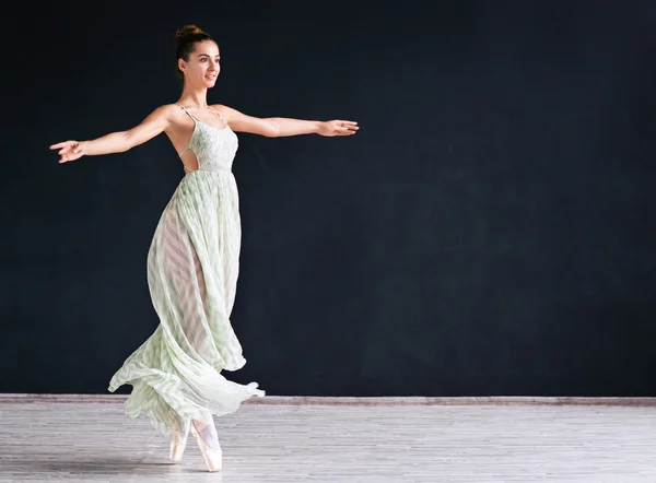 Portrait of the modern ballerina  in white dress on dark background — Stock Photo, Image