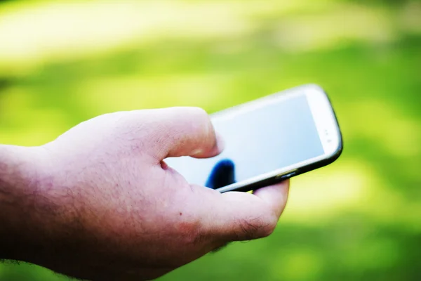 Man hands holding smartphone — Stock Photo, Image