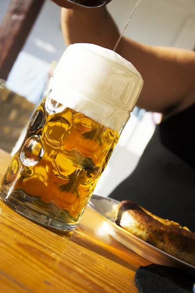 Man pouring beer for lunch — Stock Photo, Image