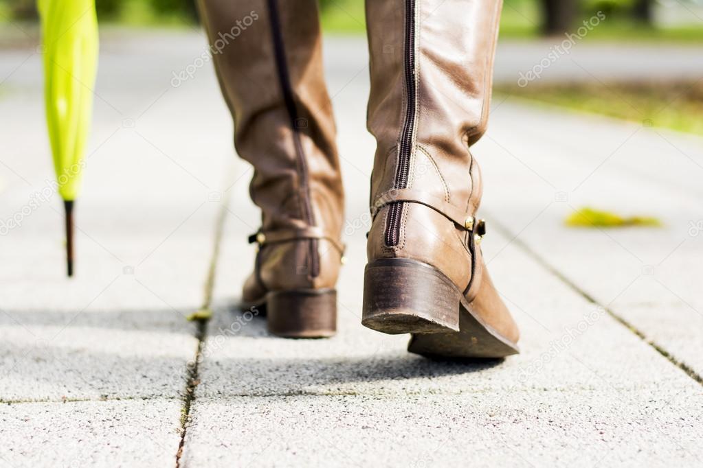 Woman in park going away