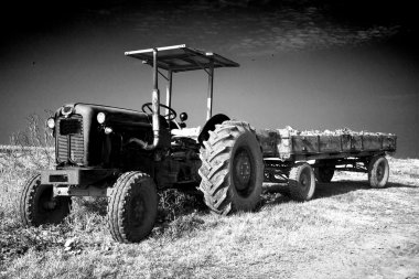 Old tractor with a trailer clipart