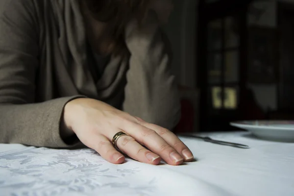 Woman sad sitting alone at the table — Stock Photo, Image