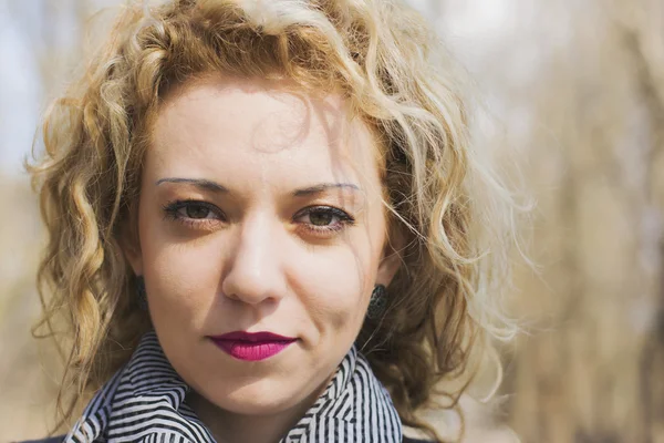 Young curly blond woman serious — Stock Photo, Image