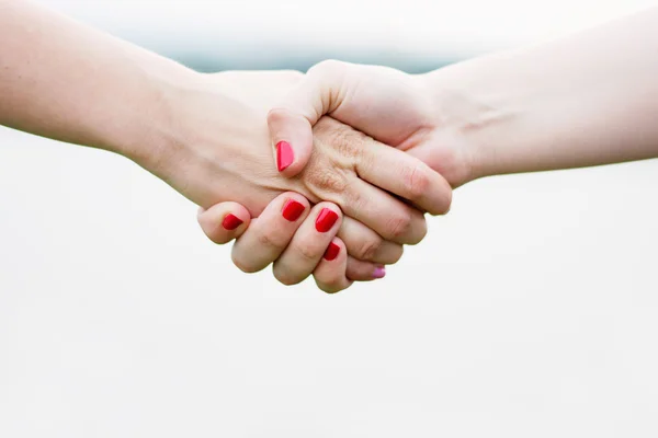 Handshake of two girls — Stock Photo, Image