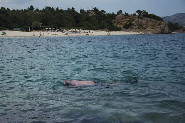 Man snorkeling in clean waters