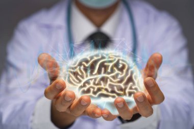 Doctor with stethoscope holding the brain on his hands, active brain waves and networking clipart