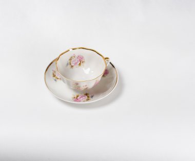 Antika porselen çay bardağı beyaz backgrou çiçek boyama ile