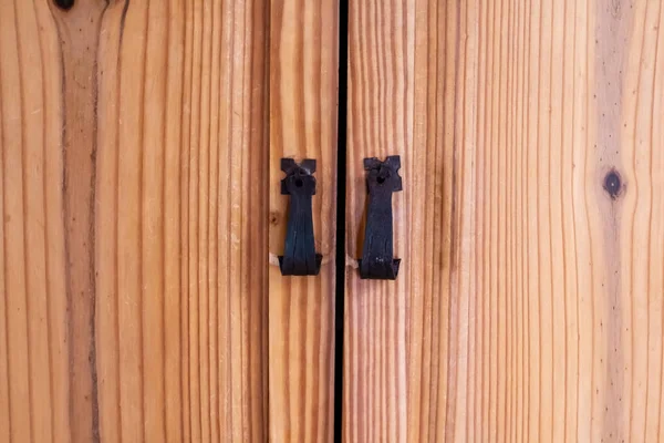 Wooden cedar wardrobe with iron pull handles on it, clean, brown knots, london ontario canada.