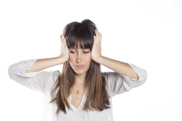 Egy fiatal nő fejfájással a kezében. — Stock Fotó