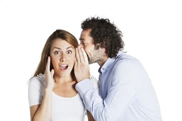 Man whispering in womans ear — Stock Photo, Image