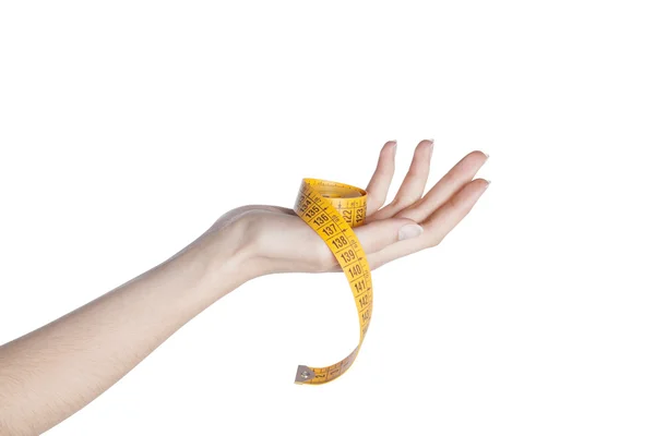 Ženská ruka drží Svinovací metr, close-up — Stock fotografie