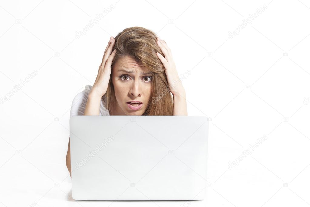 Depressed and frustrated woman working with computer laptop desperate in work. Depression concept