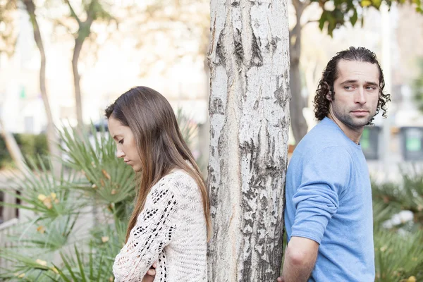 A young couple back to back after a fight — Stock Photo, Image