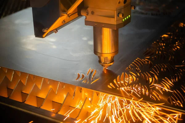 Automatic cnc laser cutting machine working with sheet metal with sparks