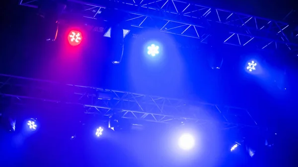 Colorful bright concert lighting equipment for stage at nightclub