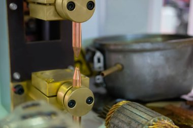 Copper electrodes of spot welding machine at factory, plant - close up clipart