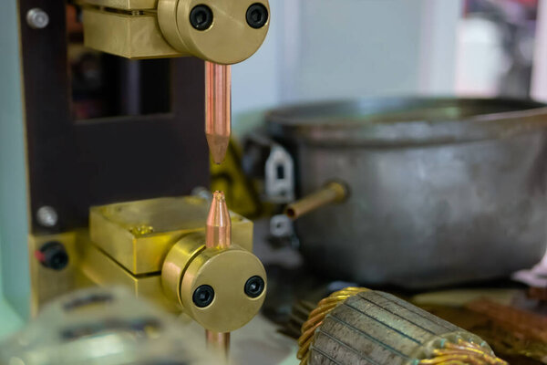 Copper electrodes of spot welding machine at factory, plant - close up