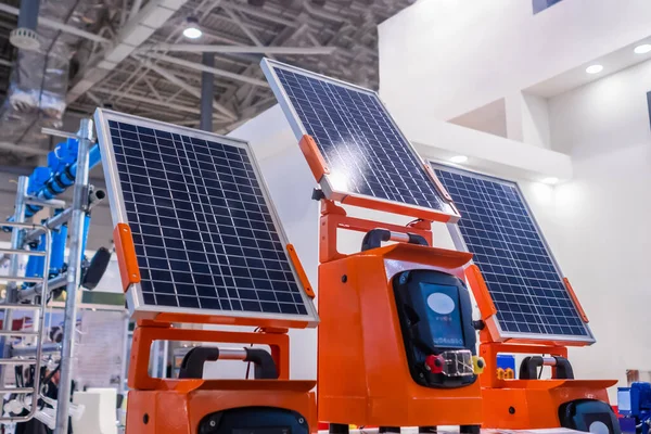 Automatic photovoltaic solar panels working at modern technology exhibition