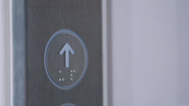 Close up: woman finger pressing elevator up button - moving up concept — Stock Video