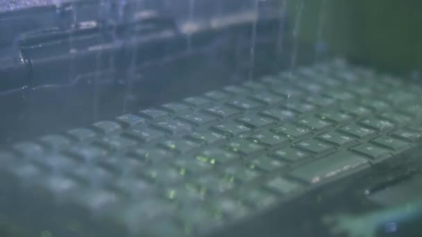 Keyboard of rugged laptop computer during water resistance test - close up — Stock Video