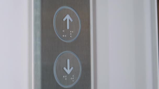 Close up: woman finger pressing elevator up button - moving up concept — Stock Video