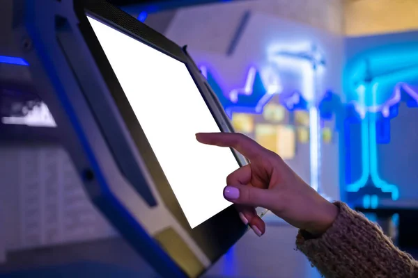Woman touching white blank display of electronic kiosk - mockup image