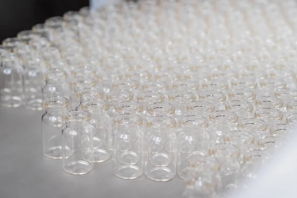 Many empty medical injection glass vials