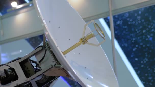 White rotating satellite dish antenna using to receive or transmit information — Stock Video