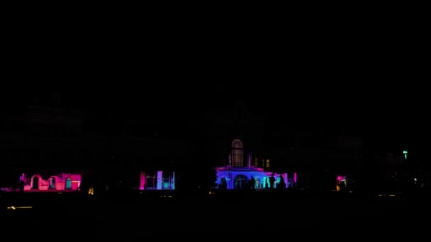 Timelapse: colorful video mapping show projected on wall of history building — 비디오