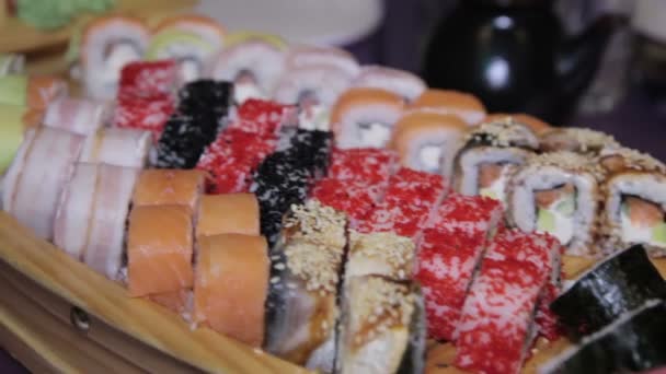 Variety of japanese sushi rolls — Stock Video