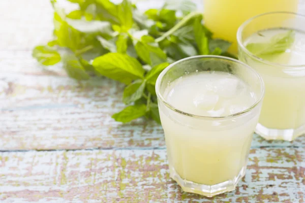 Two glass of fresh lemonade decorated with mint leaves — Stok fotoğraf