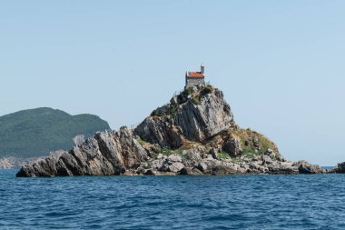 Kati and Sveta Neelja are two small islets on the Adriatic Sea, located opposite of the town of Petrovac in Montenegro. The Sveta Neelja islet has a small church. clipart