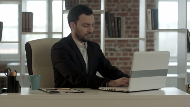 businessman finished work in front of a laptop