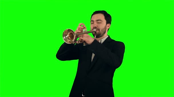 Young musician playing trumpet on a Green Screen — Stock video