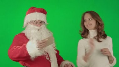 Mutlu Noel Baba Noel mektup ya da dilek listesi yeşil ekran krom anahtar okuma onun kadın Yardımcısı ile