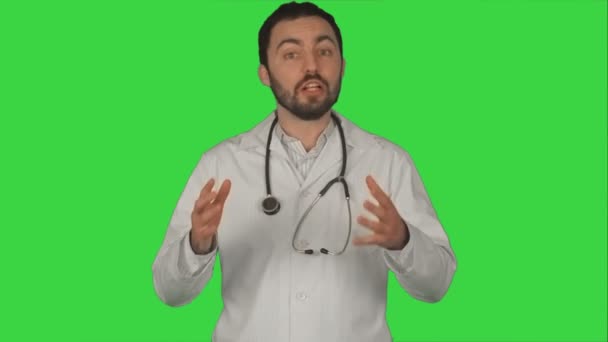 Smiling doctor gesturing thumbs up to camera on a Green Screen, Chroma Key — Stock Video