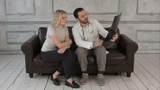 Doctor and patient looking at Xray in medical office on a Green Screen, Chroma Key — Stock Video