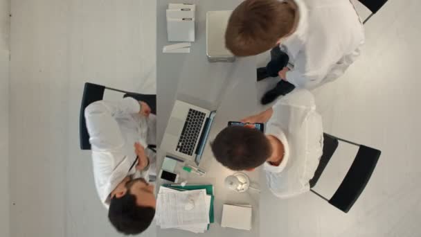 Group of happy doctors with tablet pc computers meeting at medical office. Top view — Stock Video