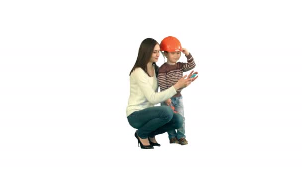 Boy taking a selfie with her mother on white background isolated — Stock Video