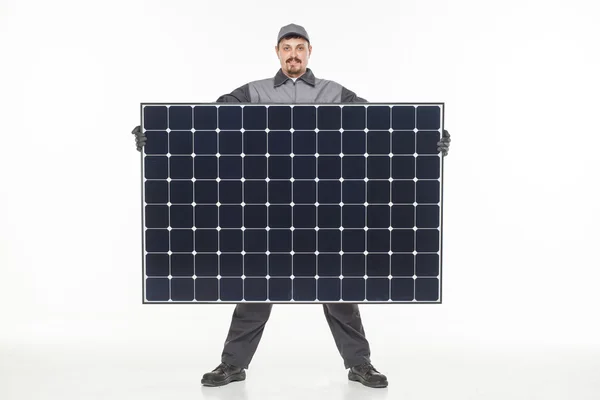 Man in uniform met een solar batterij — Stockfoto