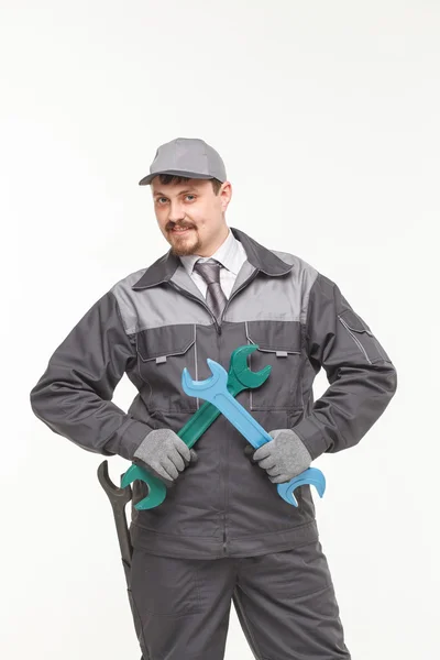Worker in uniform with wrench — Stock Photo, Image