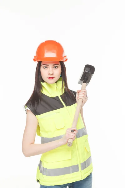 Dziewczyna w żółtą kamizelkę z narzędziem — Zdjęcie stockowe