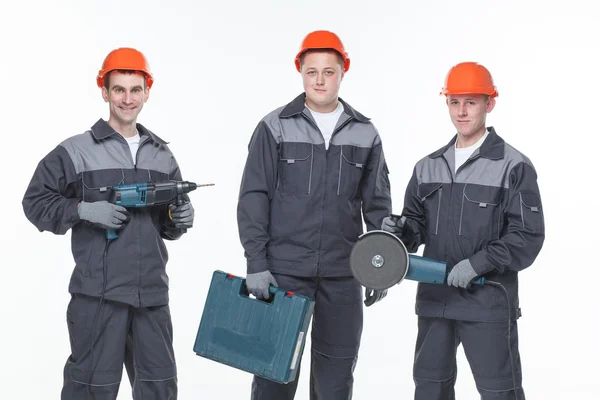 Caucásico joven diferente manual trabajador colección aislado en blanco — Foto de Stock