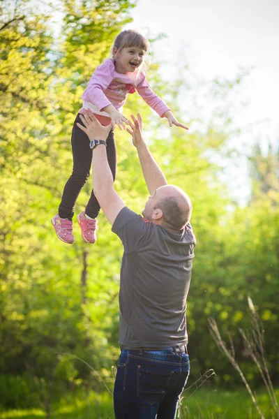 Happy family Dad throws daughter — Stock Photo, Image