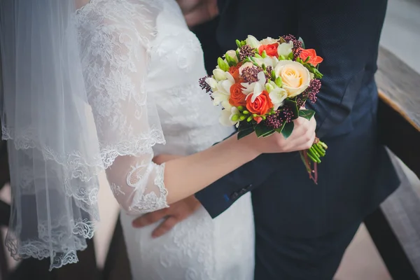 Wedding couple, beautiful young bride groom standing in a park holding hands and smiling — Stock Photo, Image