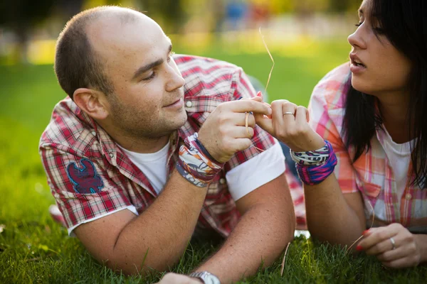 Man and woman on the grass — Stock Photo, Image