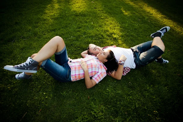 Legs, couple, laughing, grass — Stock Photo, Image
