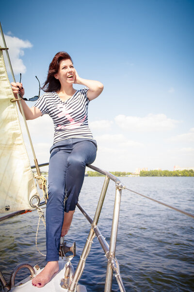 woman at the bow of the yacht