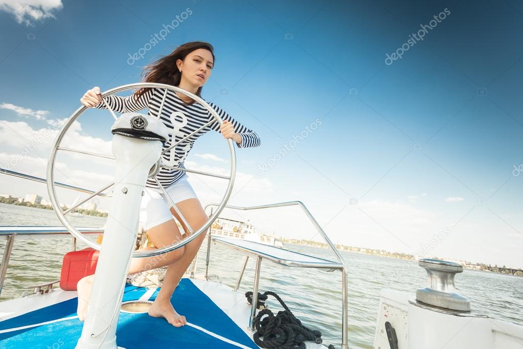 girl helm of a yacht